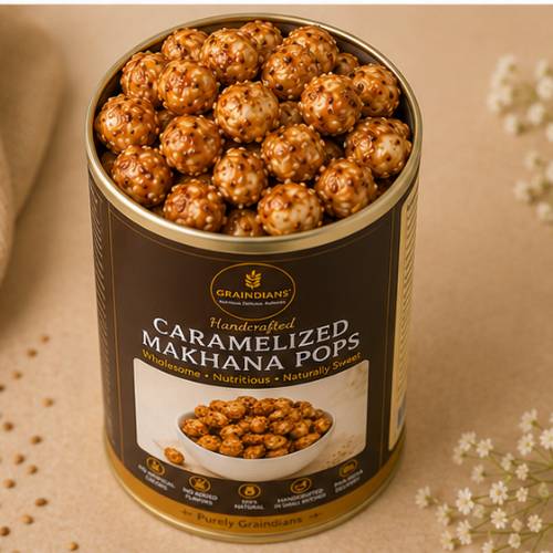 Top view of Graindians Caramelized Makhana Pops packed in premium reusable tin container