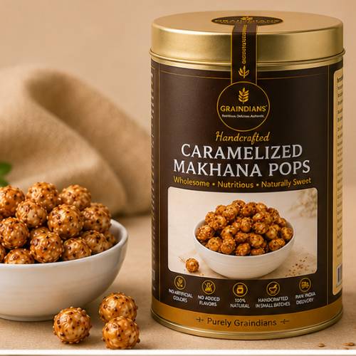 Graindians Caramelized Makhana Pops premium handcrafted fox nuts in elegant brown and gold tin packaging